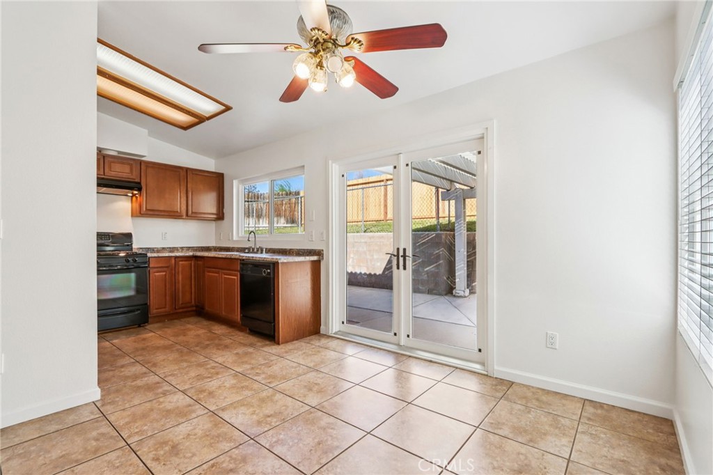 12059 Elk Boulevard Riverside, CA 92505 - Photo 8 of 29 a kitchen with stainless steel appliances granite countertop a refrigerator and a sink
