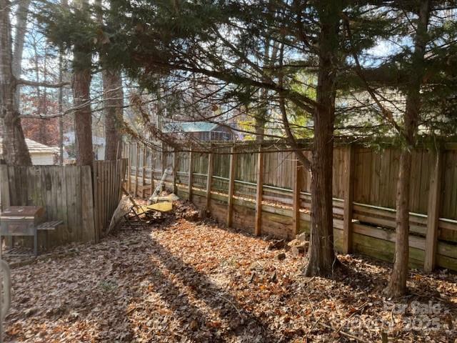 127 Deer Park Road Mount Gilead, NC 27306 - Photo 12 of 15 a backyard of a house with lots of green space