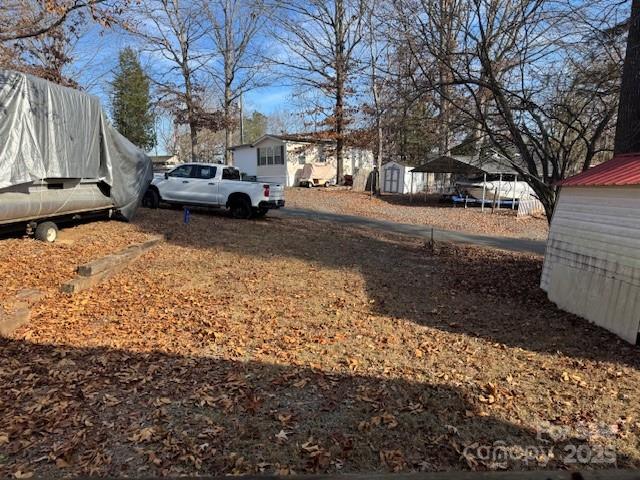 127 Deer Park Road Mount Gilead, NC 27306 - Photo 4 of 15 a view of street with parked cars