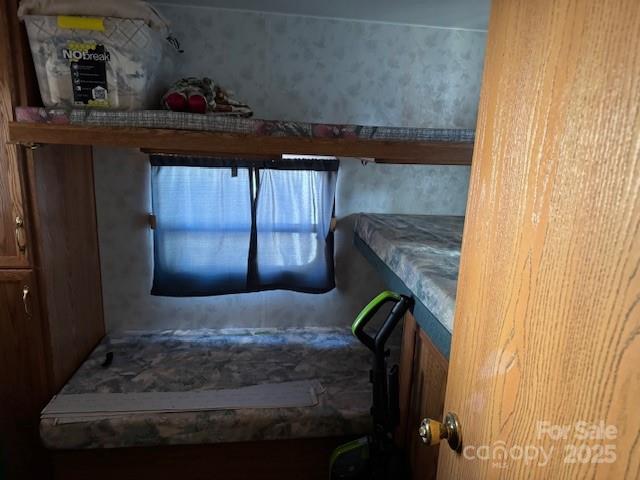 127 Deer Park Road Mount Gilead, NC 27306 - Photo 6 of 15 a bedroom with a bed and a window