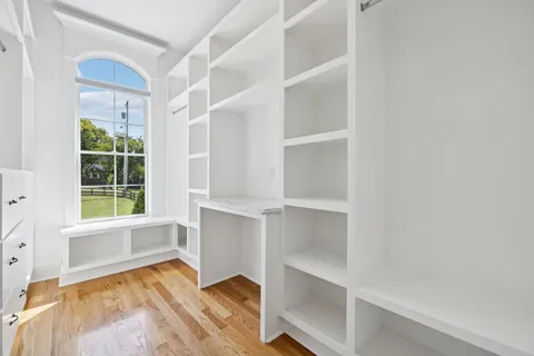 a bathroom with a granite countertop sink a toilet and a bathtub