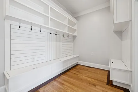 a bathroom with a granite countertop toilet sink and mirror