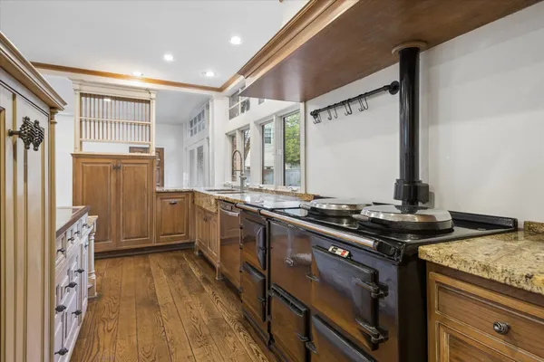 a kitchen with stainless steel appliances a stove top oven and refrigerator