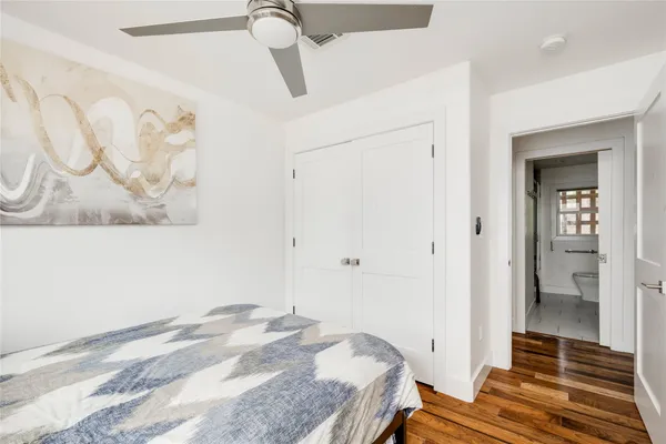 a bedroom with a bed and a shower