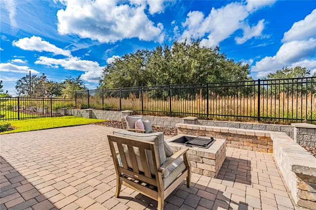 a living room with furniture and a large mirror