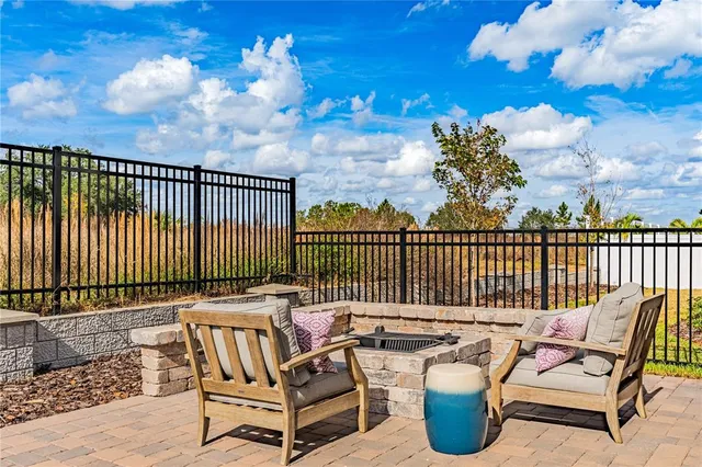 a kitchen with a refrigerator a stove and a cabinets