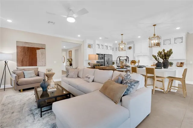 a view of a dining room with furniture wooden floor and chandelier