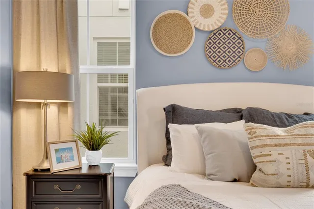 a bedroom with a large bed and a window