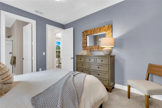 a bathroom with a double vanity sink a mirror a bathtub and shower