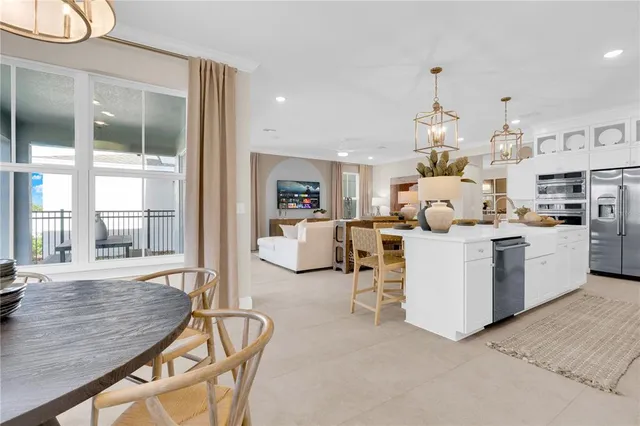 a bathroom with a tub a sink and a window