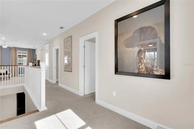 a en suite bathroom with a granite countertop sink and a mirror