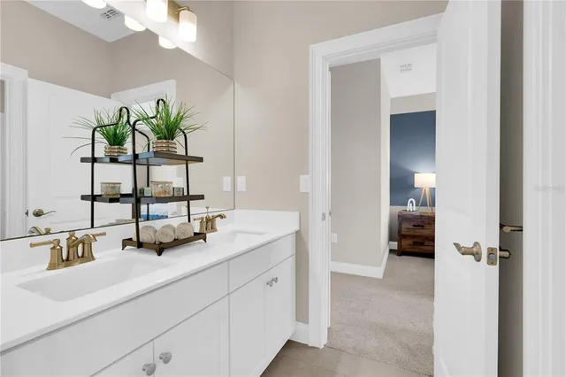 a bathroom with a sink a toilet and mirror