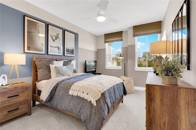 a living room with furniture a table and a painting