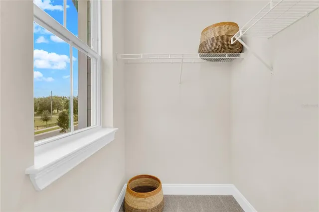 a aerial view of a house with swimming pool and sitting area