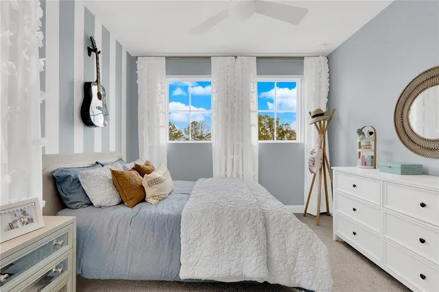 an aerial view of residential houses with outdoor space and street view