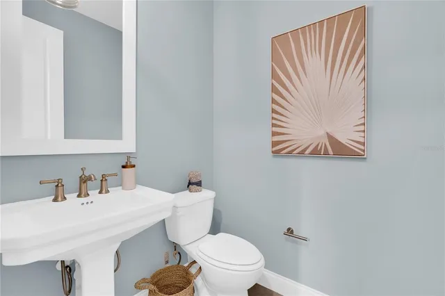 a living room with lots of furniture and a large window