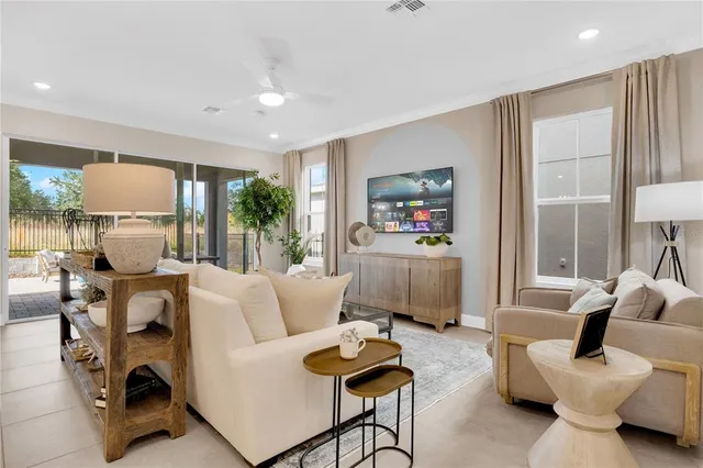 a view of a house with swimming pool and sitting area