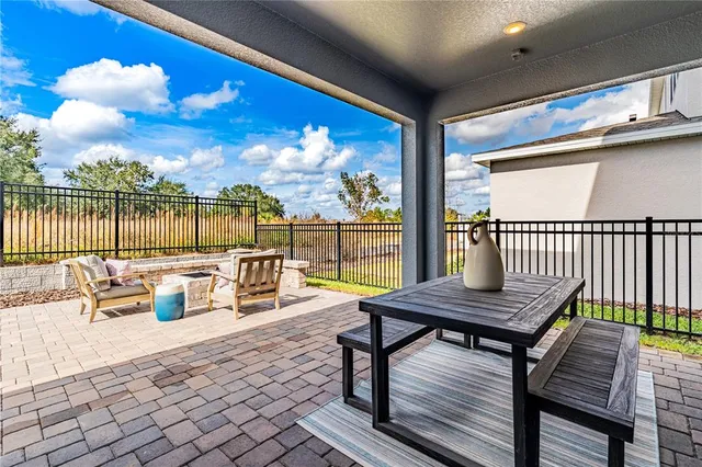 a view of a swimming pool with a lounge chairs