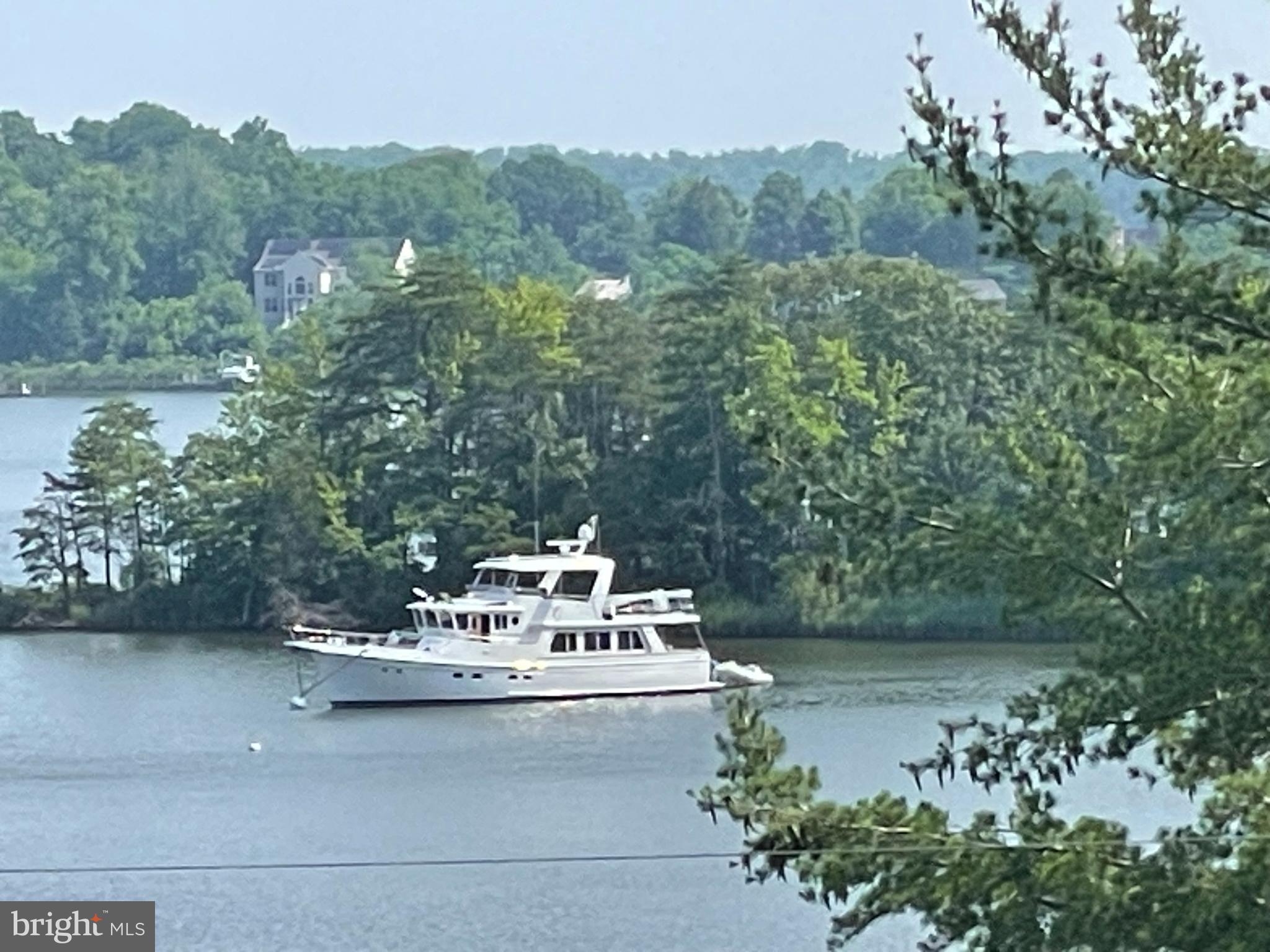 3325 Glebe Drive Edgewater, MD 21037 - Photo 60 of 84 a view of a lake with a mountain in the background