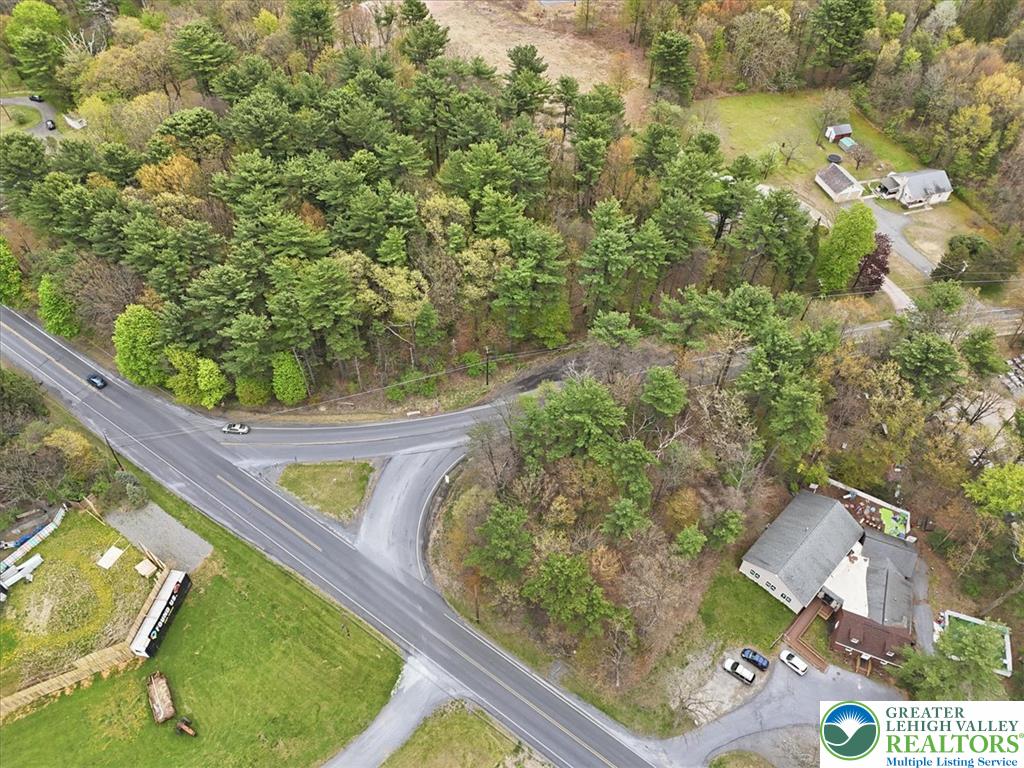 Interchange Road Lehighton, PA 18235 - Photo 32 of 40 An aerial perspective reveals a tree-lined lot with a residential structure and adjacent roadways.