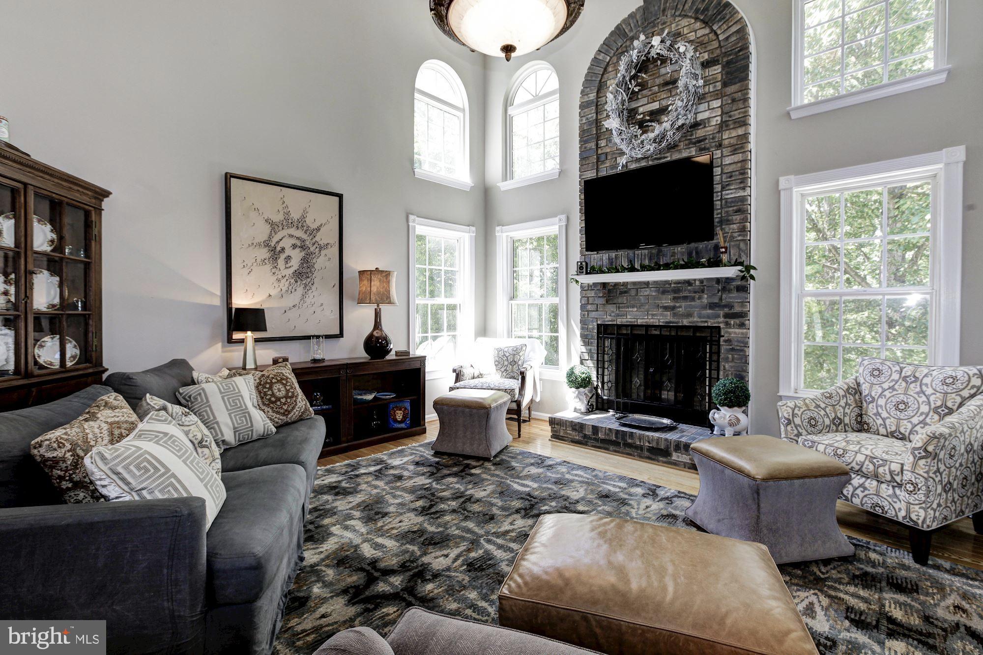 6422 Spring Forest Road Frederick, MD 21701 - Photo 12 of 37 Natural Light & Wood Fireplace In Family Room