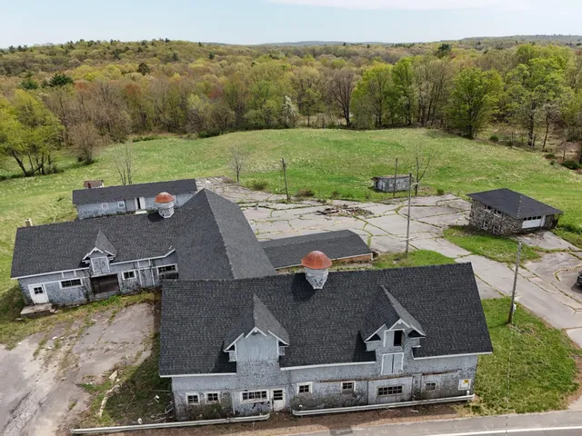 an aerial view of a house with a garden