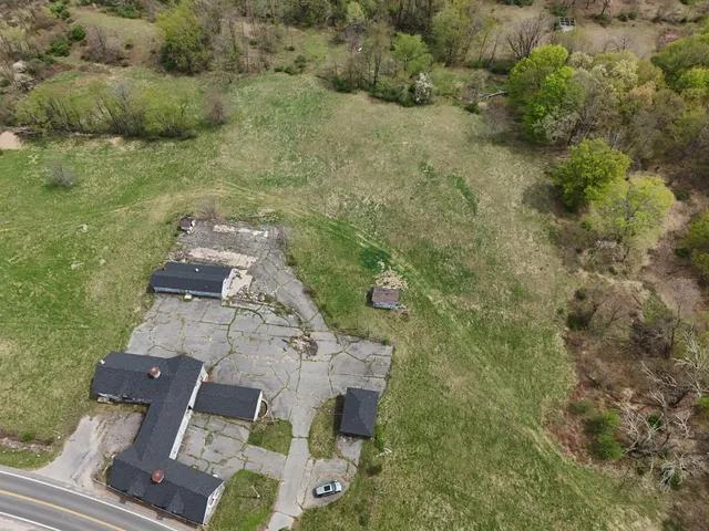 an aerial view of residential house with outdoor space