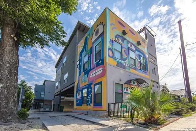 a view of a building with a street