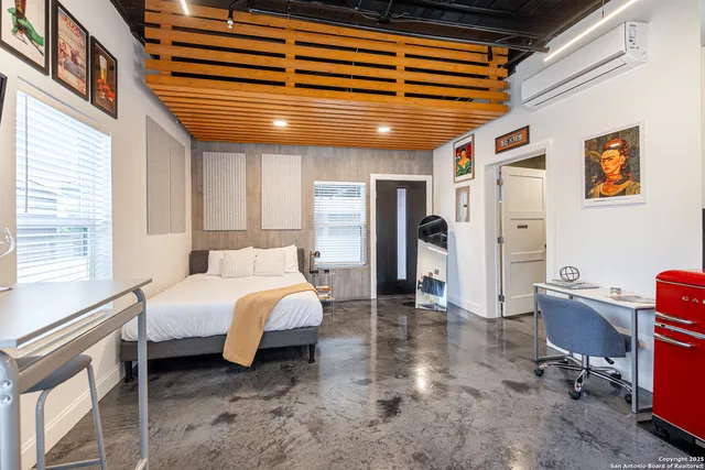 a room with furniture and a flat screen tv