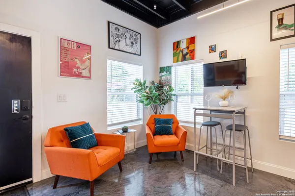 a view of a kitchen with a washer and dryer