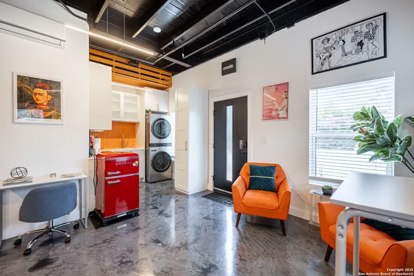 a bedroom with furniture and a window