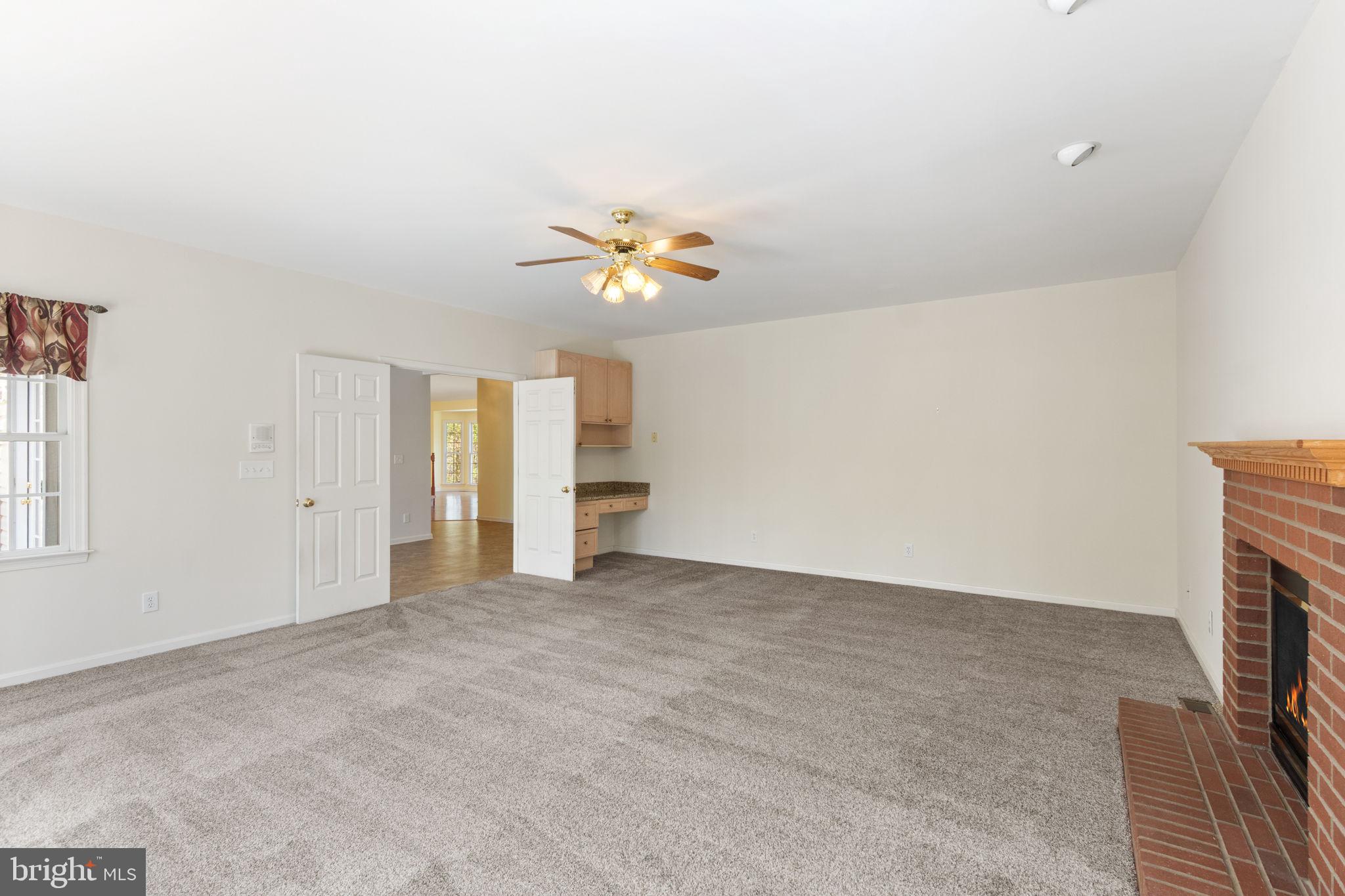 15 Riva Ridge Drive Stafford, VA 22556 - Photo 16 of 49 Family room feature brick FP & build in desk