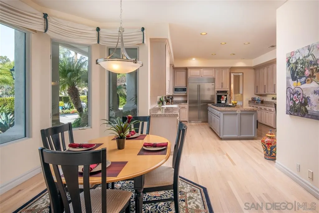 7430 St Andrews Road Rancho Santa Fe, CA 92067 - Photo 15 of 25 a dining room with furniture a chandelier and window