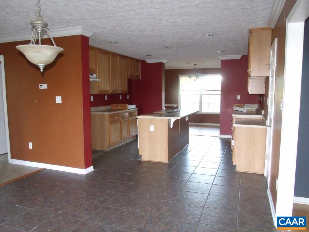 1651 South Constitution Route Dillwyn, VA 23936 - Photo 6 of 13 a view of a kitchen with a sink cabinets and a floor to ceiling window