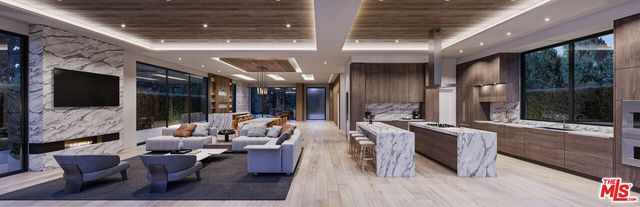 a living room with patio furniture and a flat screen tv