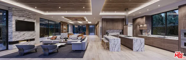 a living room with patio furniture and a flat screen tv