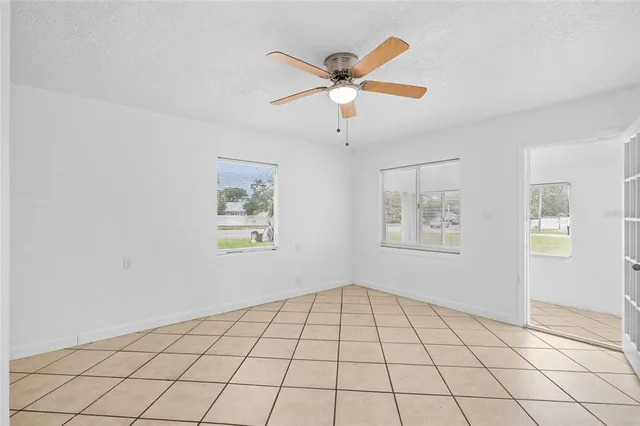 a view of a refrigerator and window in a room