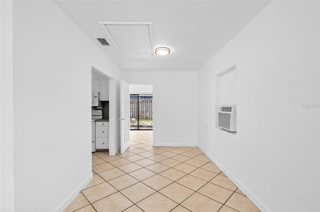2196 Bell Cheer Drive Clearwater, FL 33764 - Photo 13 of 55 a view of a refrigerator and window in a room