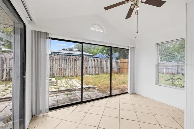 a view of an empty room and bathroom