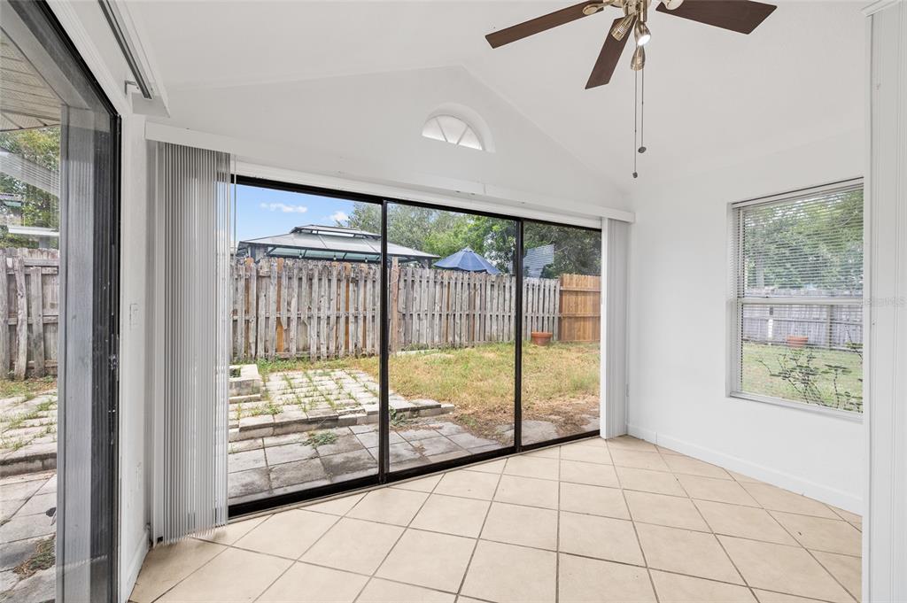 2196 Bell Cheer Drive Clearwater, FL 33764 - Photo 18 of 55 a view of an empty room and window chandelier fan