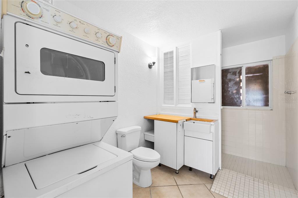2196 Bell Cheer Drive Clearwater, FL 33764 - Photo 23 of 55 a bathroom with a toilet sink and mirror