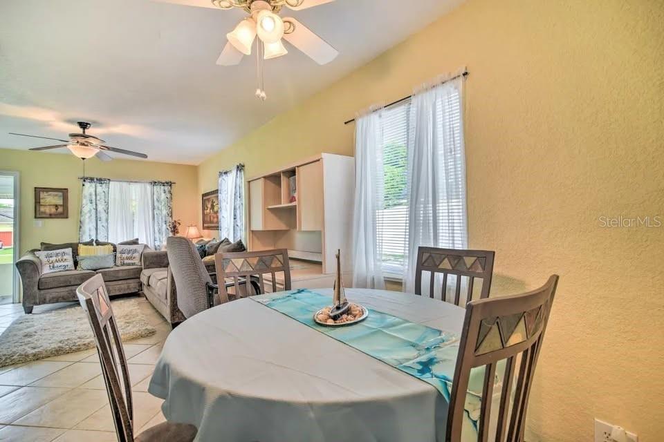 2196 Bell Cheer Drive Clearwater, FL 33764 - Photo 26 of 55 a view of a dining room with furniture window and outside view