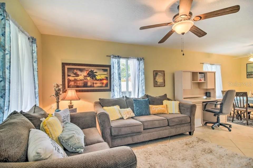2196 Bell Cheer Drive Clearwater, FL 33764 - Photo 35 of 55 a living room with furniture and a large window