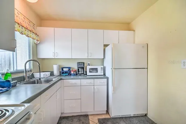 a view of a chairs and table on the terrace