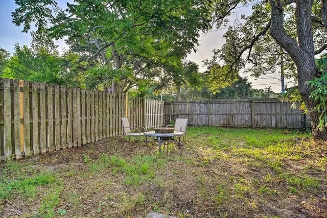 a view of a chair and table in the patio
