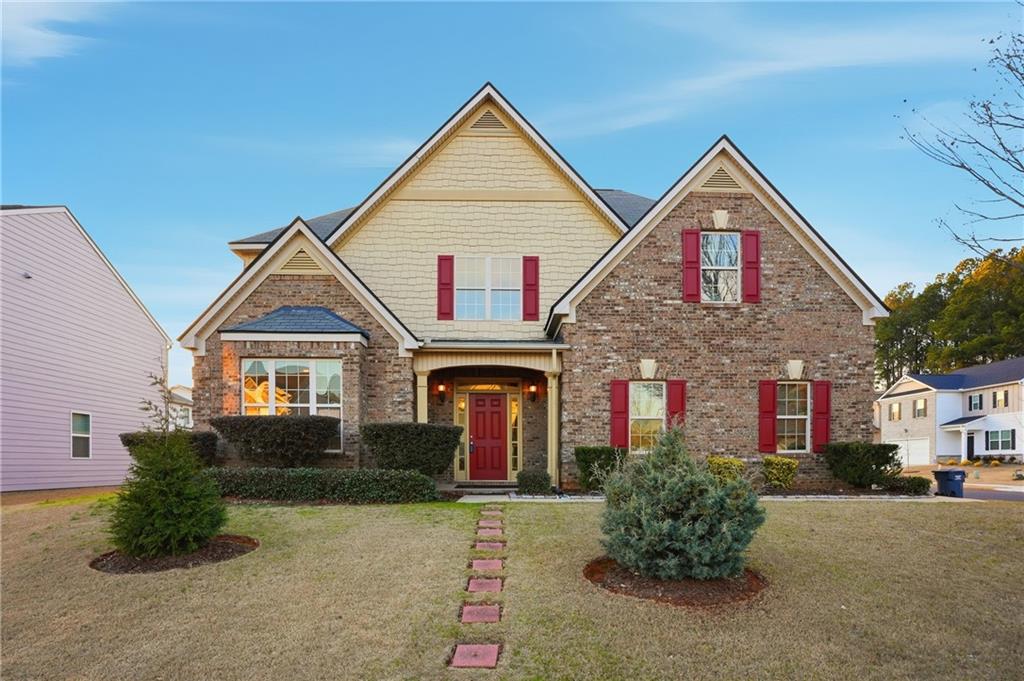 a front view of a house with yard