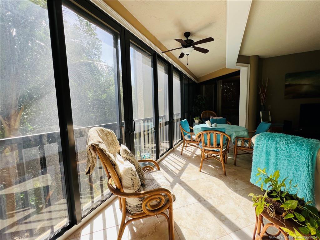 221 Northeast Plantation Road, Unit 215 Stuart, FL 34996 - Photo 57 of 83 a view of a porch with furniture