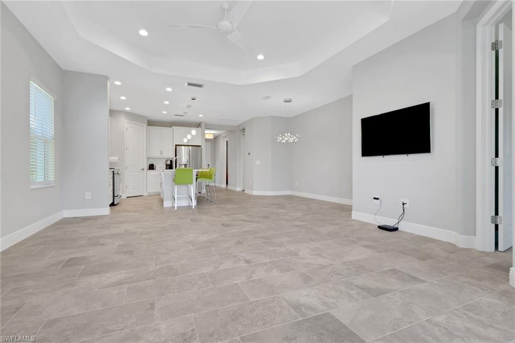 2231 Marquesa Circle Naples, FL 34112 - Photo 11 of 38 a view of a livingroom with a flat screen tv
