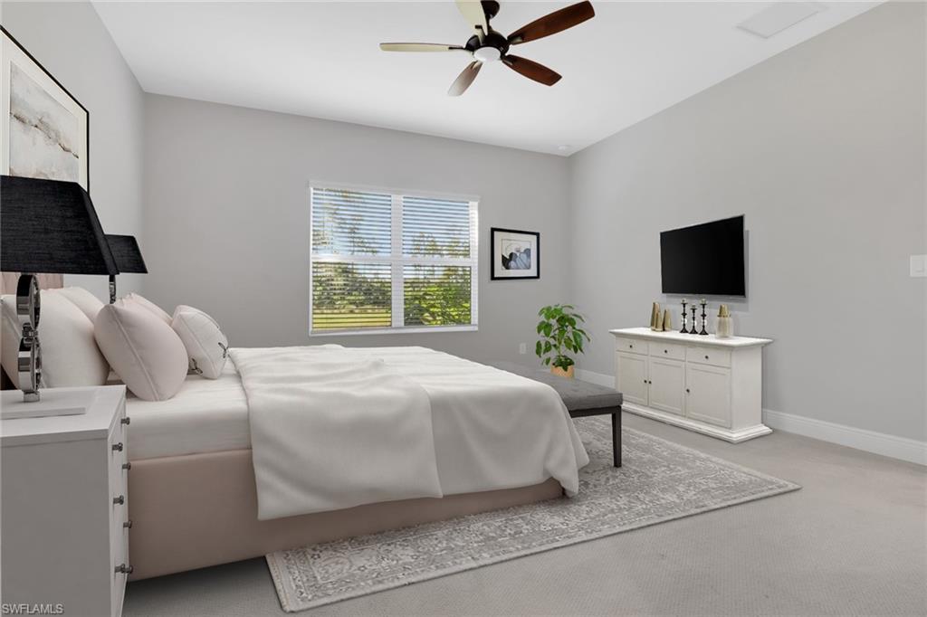 2231 Marquesa Circle Naples, FL 34112 - Photo 16 of 38 a bedroom with a bed and a flat screen tv
