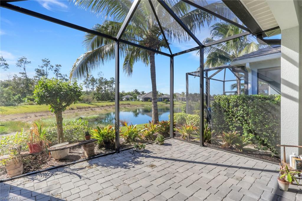 2231 Marquesa Circle Naples, FL 34112 - Photo 26 of 38 a view of a lake with a patio
